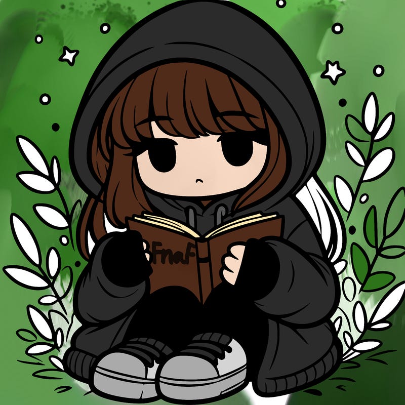 girl in oversized hoodie reading a book