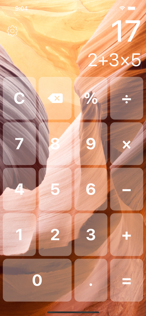 Big Button Calculator Pro Lite - A calculator interface with large buttons and a dual line display showing a calculation over a nature background