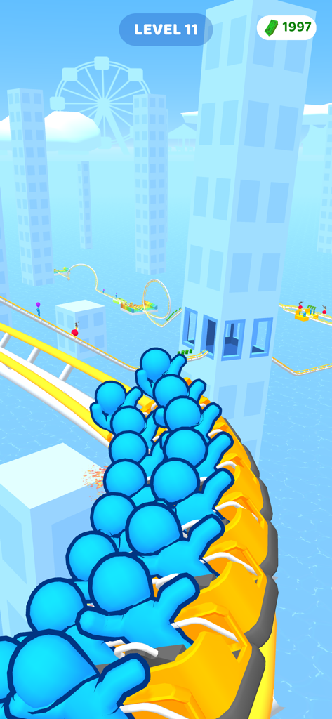 A yellow roller coaster train with blue passengers moving through a city with skyscrapers in the mobile game Runner Coaster.