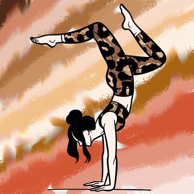a woman doing a handstand