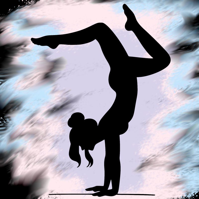 a woman doing a handstand