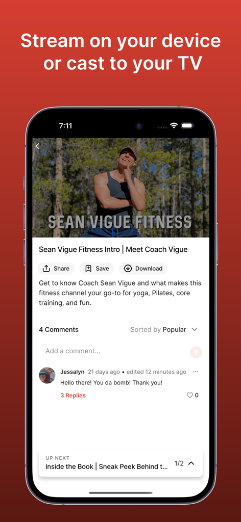 Smartphone displaying the Sean Vigue Fitness app video player with streaming and download options.