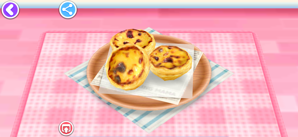 Três tortinhas de ovo assadas em um prato no jogo Cooking Mama