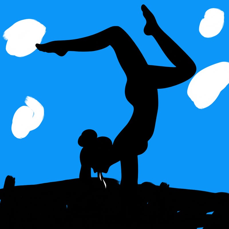 a woman doing a handstand