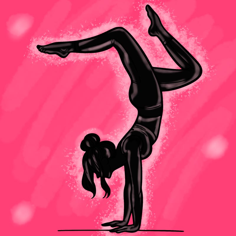 a woman doing a handstand