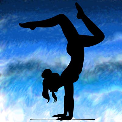a woman doing a handstand
