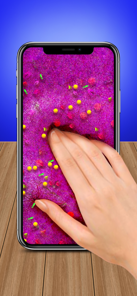 A hand squishing vibrant pink virtual slime with fruit-themed decorations on a phone screen