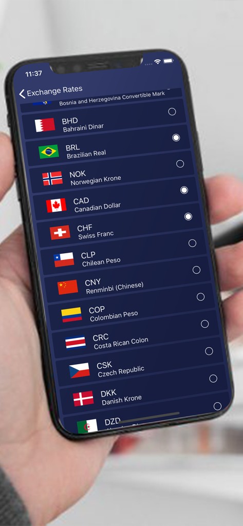 Currency Conversion ٞ - A smartphone screen displaying a list of world currencies with flags and names in alphabetical order.