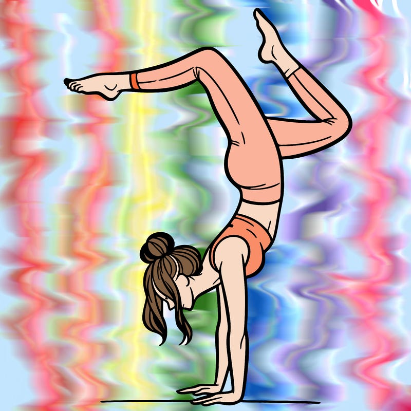 a woman doing a handstand