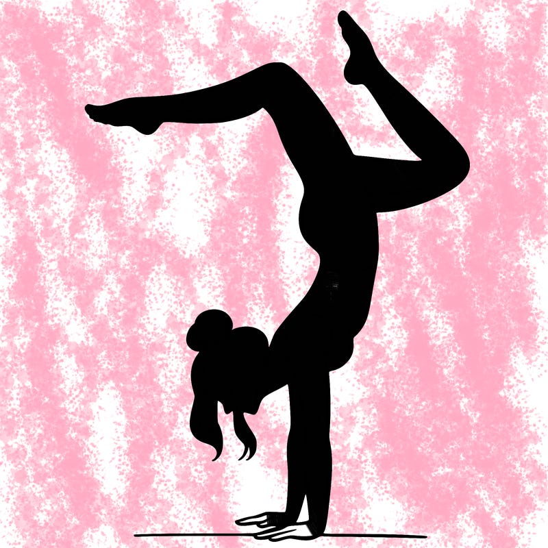 a woman doing a handstand
