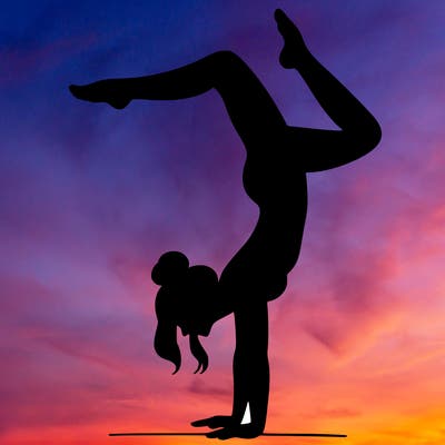 a woman doing a handstand