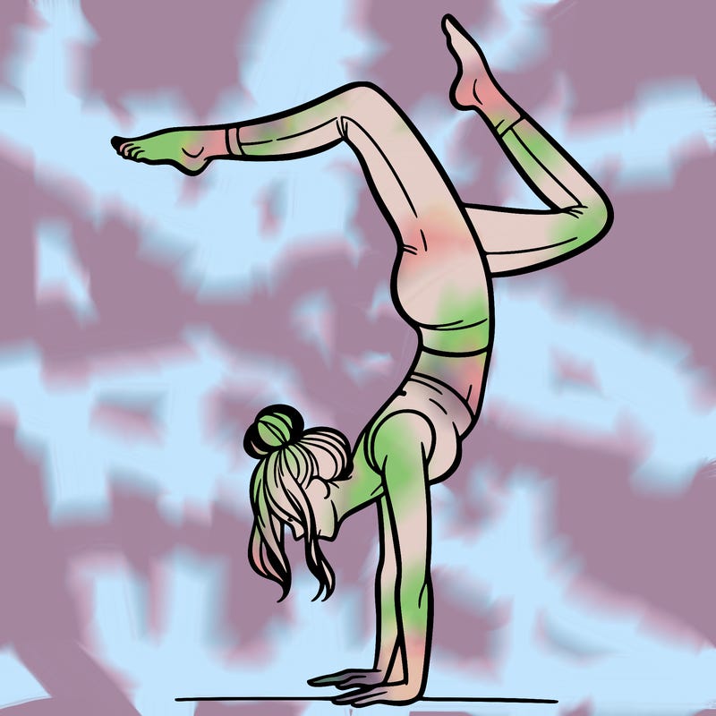 a woman doing a handstand