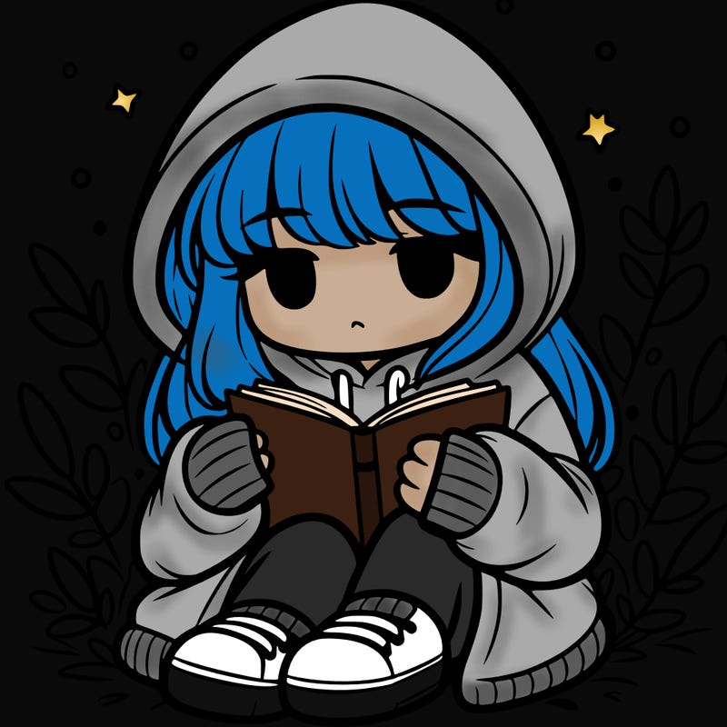 girl in oversized hoodie reading a book