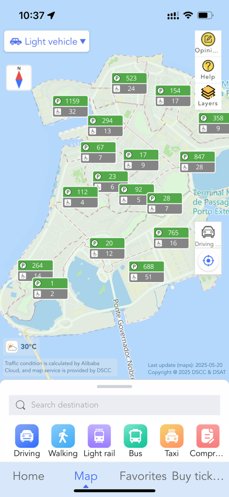 Map interface of the Macao Smart Go app showing real-time parking availability and various transportation modes like bus and light rail.