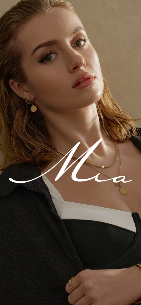 Mia Bijoux - A woman wearing gold necklaces and earrings by Mia Bijoux