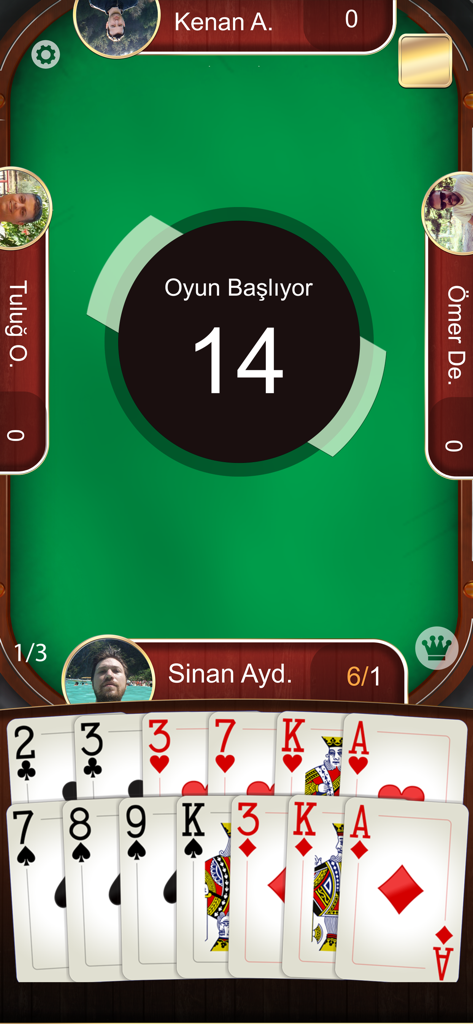 A mobile screen showing the Batak Online game interface with a green table and a hand of playing cards