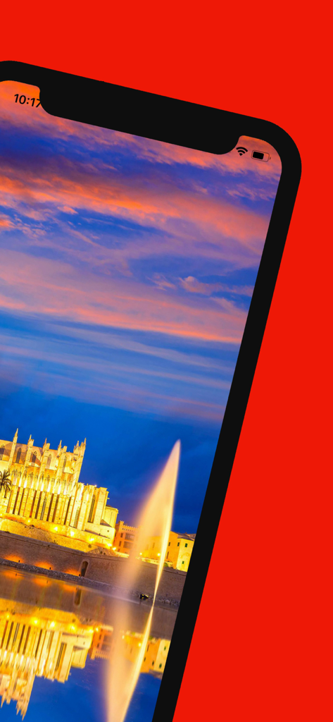 Mallorca Reiseführer-App zeigt einen malerischen Sonnenuntergang über der Kathedrale von Palma über dem Wasser.