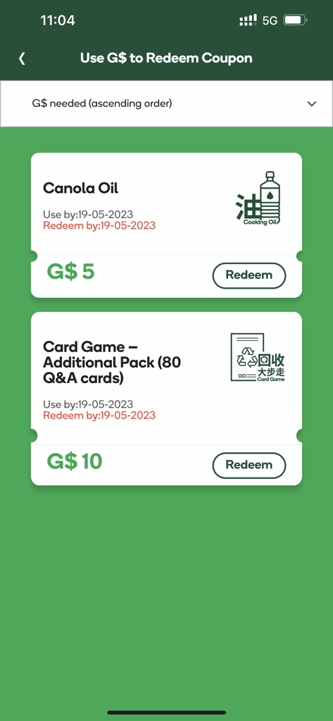 綠綠賞手機應用程式 - Pantalla de canje de recompensas en la aplicación GREEN$ mostrando cupones para aceite de canola y juegos de cartas.