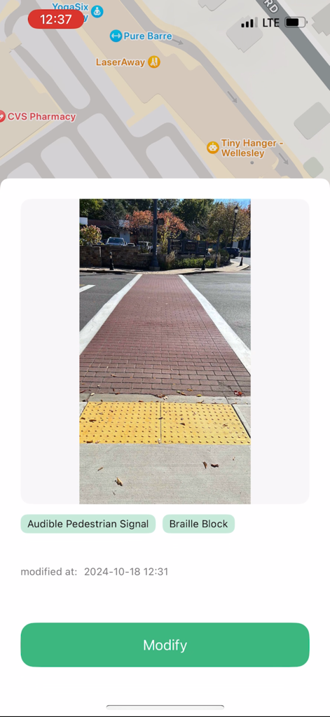 WayPoint. - WayPoint app screenshot showing a crosswalk photo with yellow tactile paving and accessibility status tags