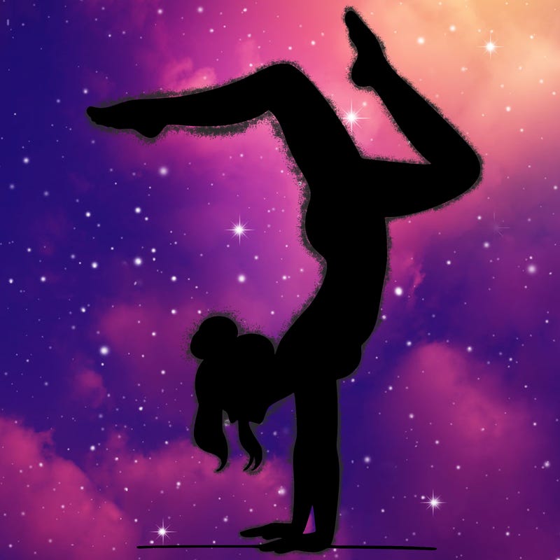 a woman doing a handstand