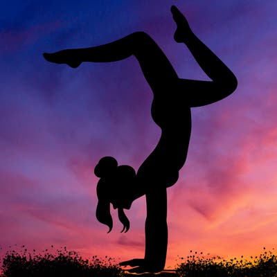 a woman doing a handstand