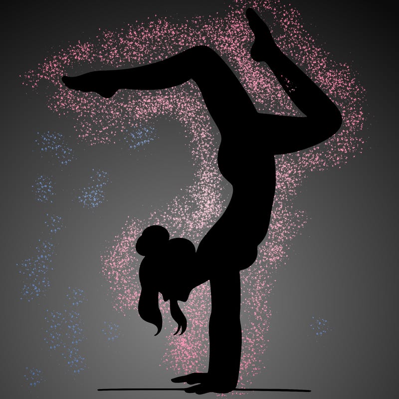 a woman doing a handstand