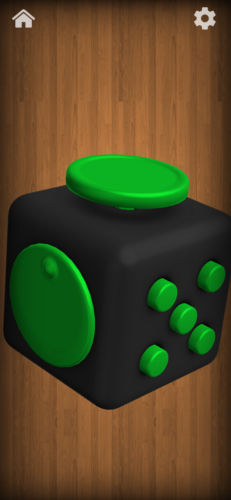 A black and green digital fidget cube toy on a wooden background in the Antistress app