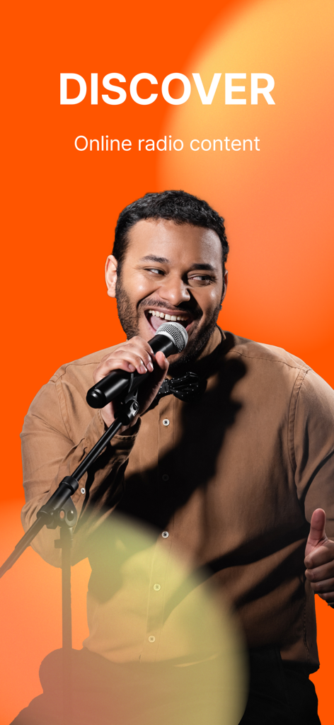 A man smiling and speaking into a microphone under the text Discover online radio content on an orange background