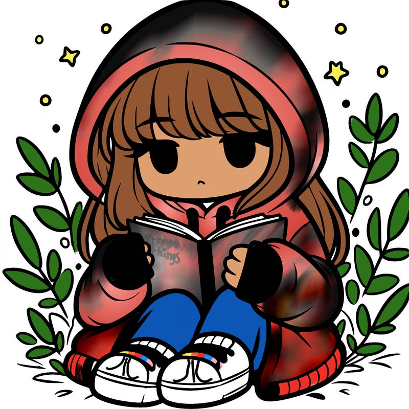 girl in oversized hoodie reading a book