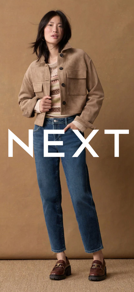 Next: Shop Fashion & Homeware - A woman wearing a stylish tan jacket and blue jeans with the white Next logo