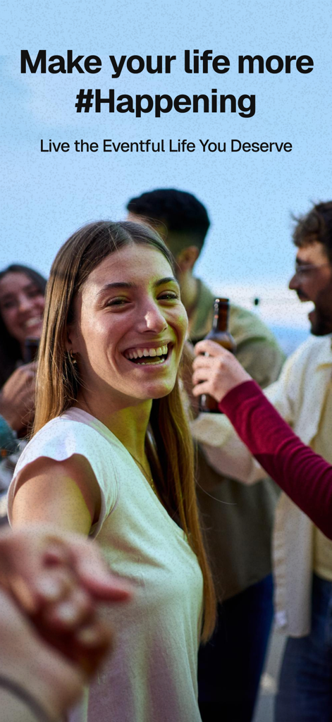 A group of smiling young adults enjoying a social event outdoors