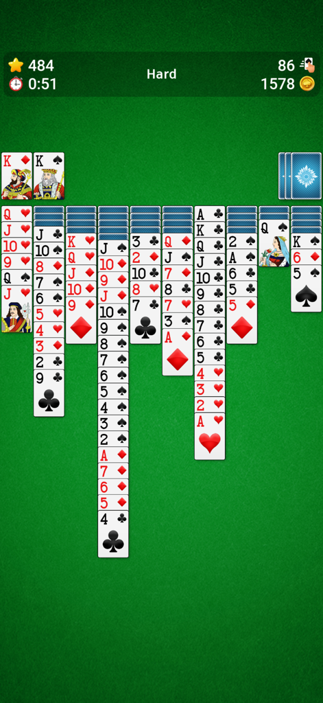 Spider Solitaire` - Classic Spider Solitaire gameplay on a green background featuring cards in Hard mode