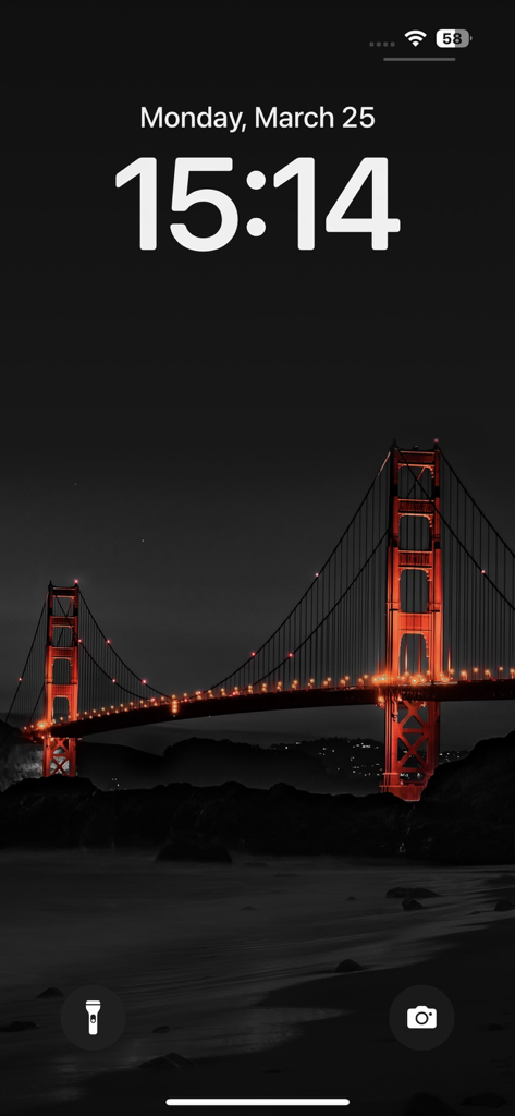 Wallpapers for phone & themes - iPhone lock screen featuring a dark aesthetic wallpaper of the Golden Gate Bridge with glowing red lights at night