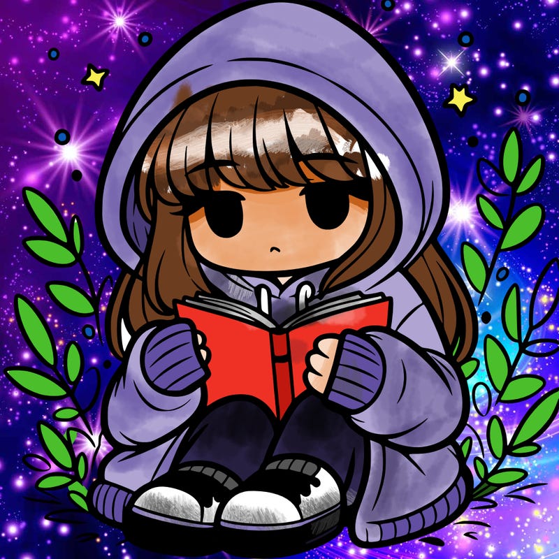 girl in oversized hoodie reading a book