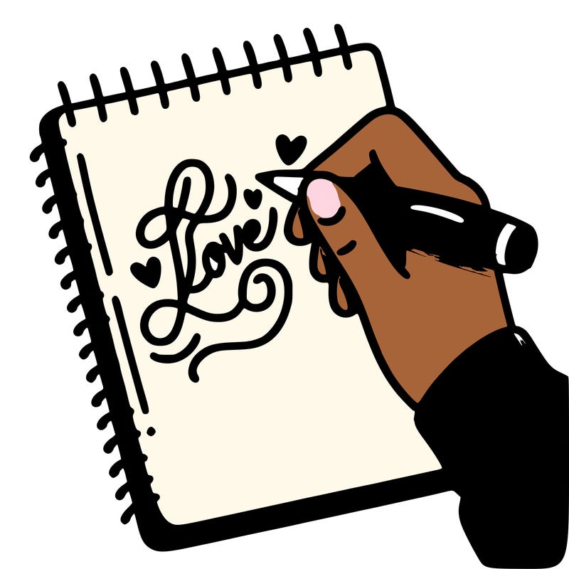 a hand writing “love” in calligraphy on a notebook