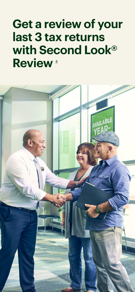 An H and R Block tax professional shakes hands with a couple in an office setting for a Second Look Review of past tax returns.