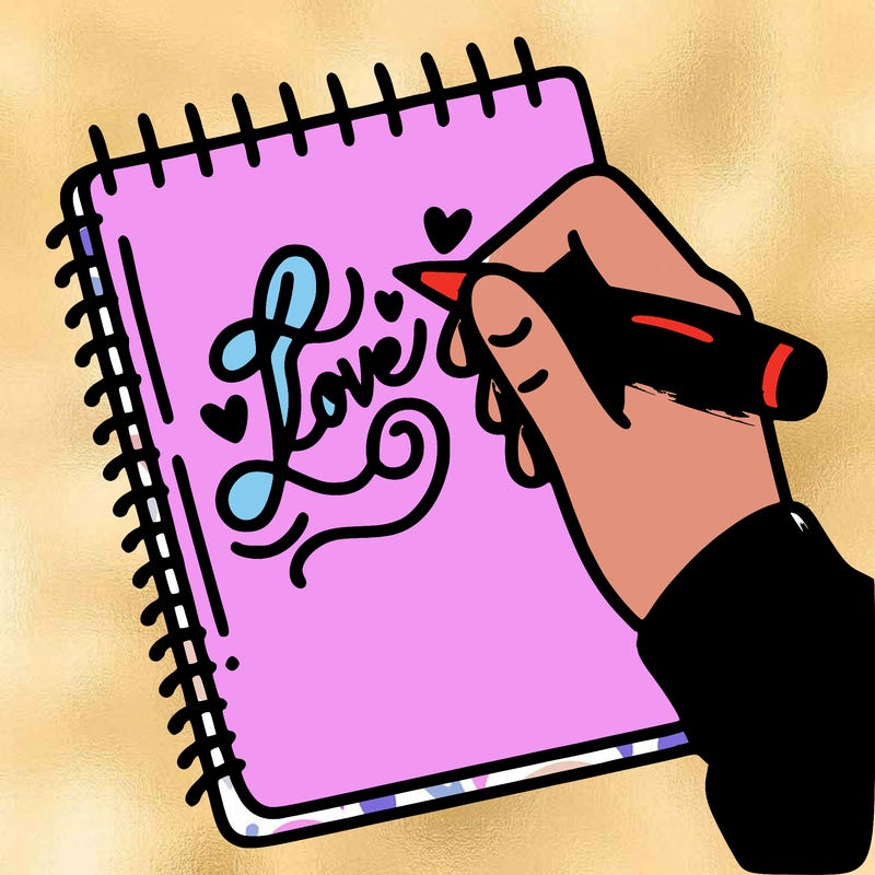 a hand writing “love” in calligraphy on a notebook