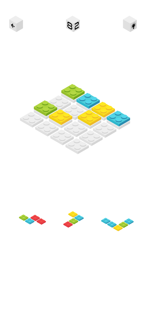 3D isometric block puzzle gameplay with colorful bricks on a minimalist white grid