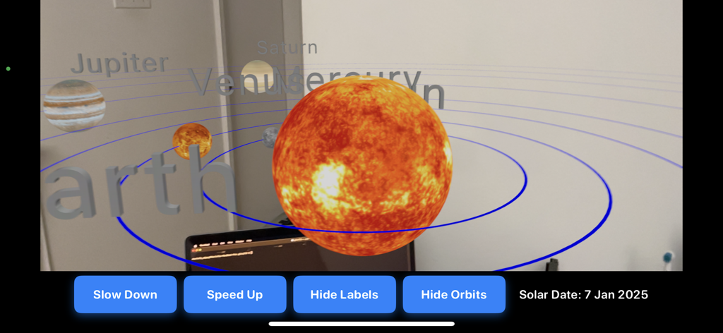 An educational augmented reality view showing the sun and planets of the solar system with visible orbits