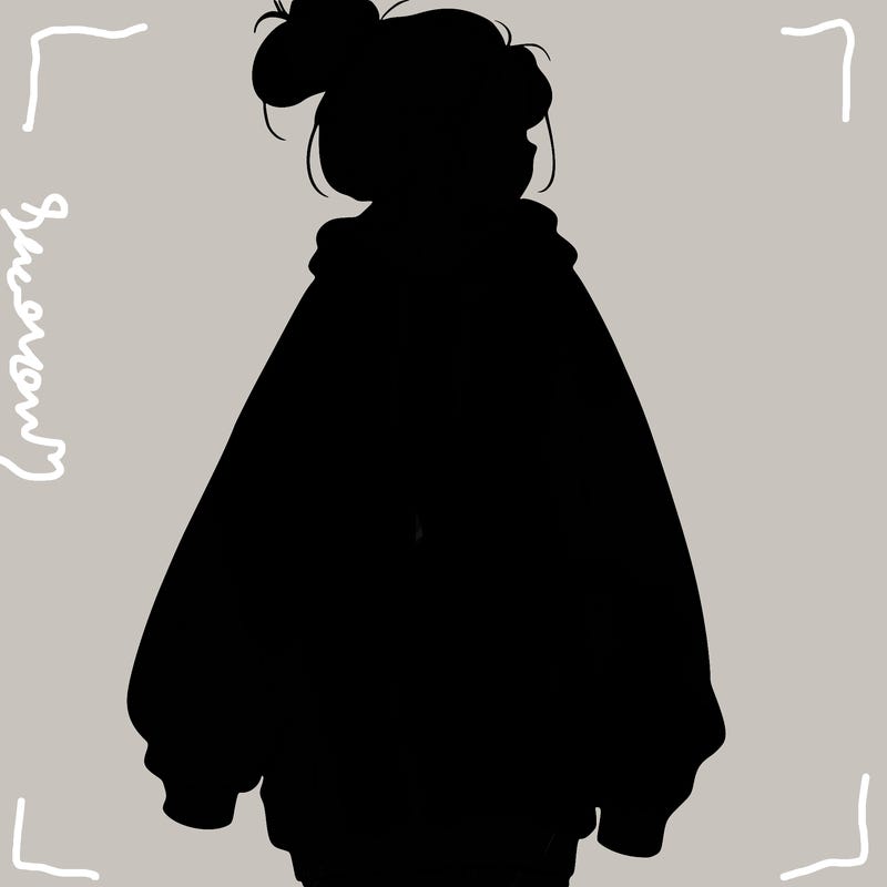 realistic girl with a oversized sweatshirt on and a bun