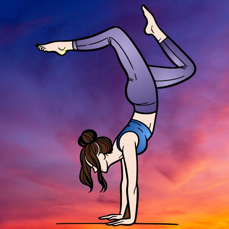 a woman doing a handstand