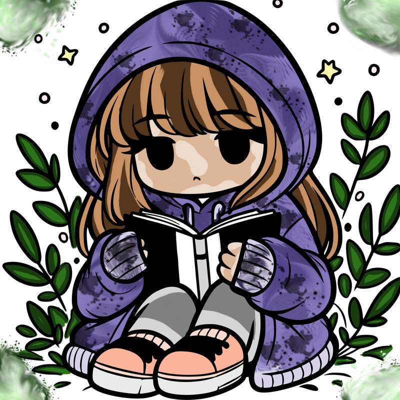 girl in oversized hoodie reading a book