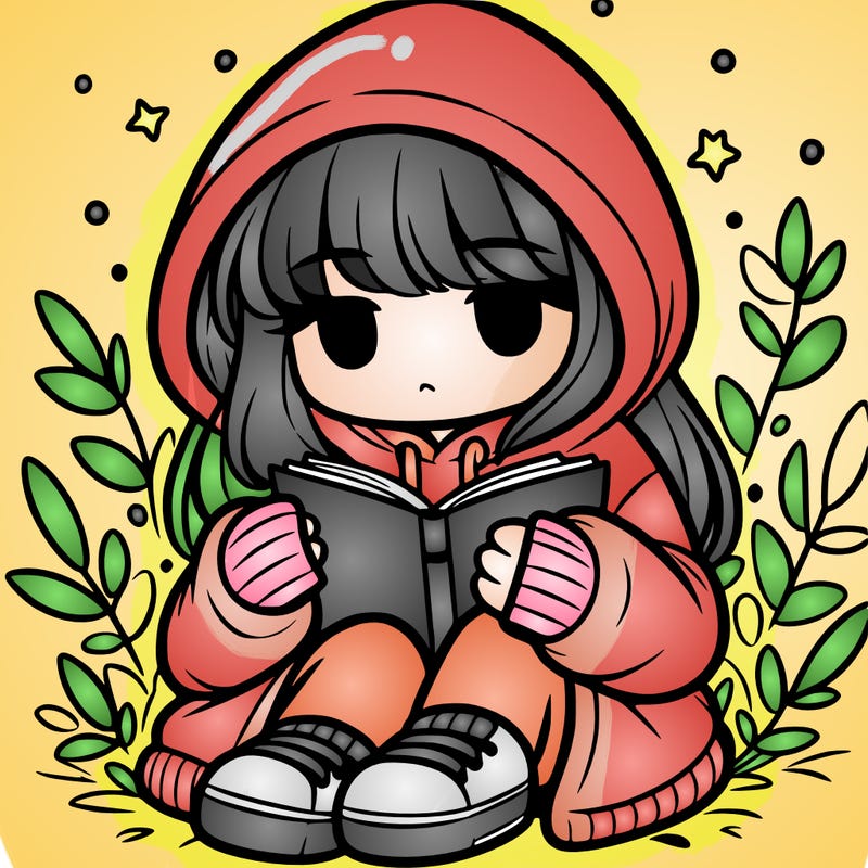 girl in oversized hoodie reading a book