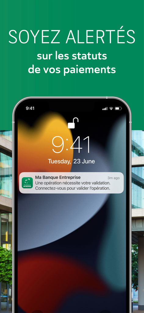Smartphone lock screen displaying a transaction validation notification from the Ma Banque Entreprise app