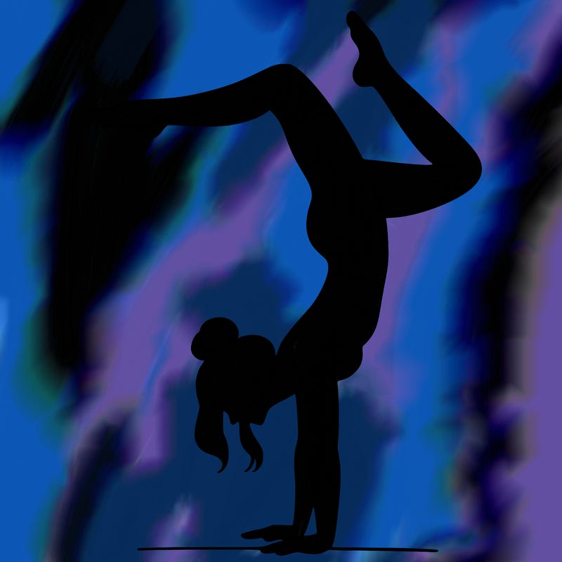 a woman doing a handstand