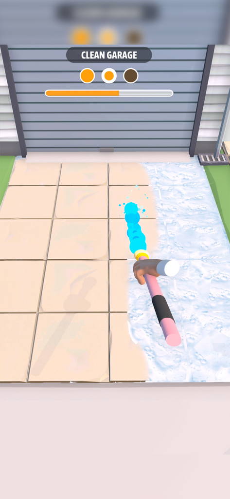 A first person view of power washing dirty floor tiles in the Cleaning Games Clean It All mobile app