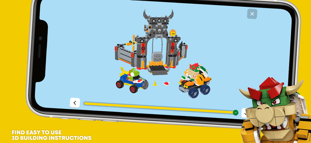 A smartphone showing 3D digital building instructions for a LEGO Super Mario set featuring Bowser and cars