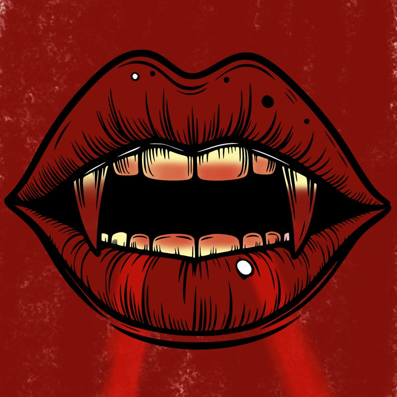 lips with vampire teeth
