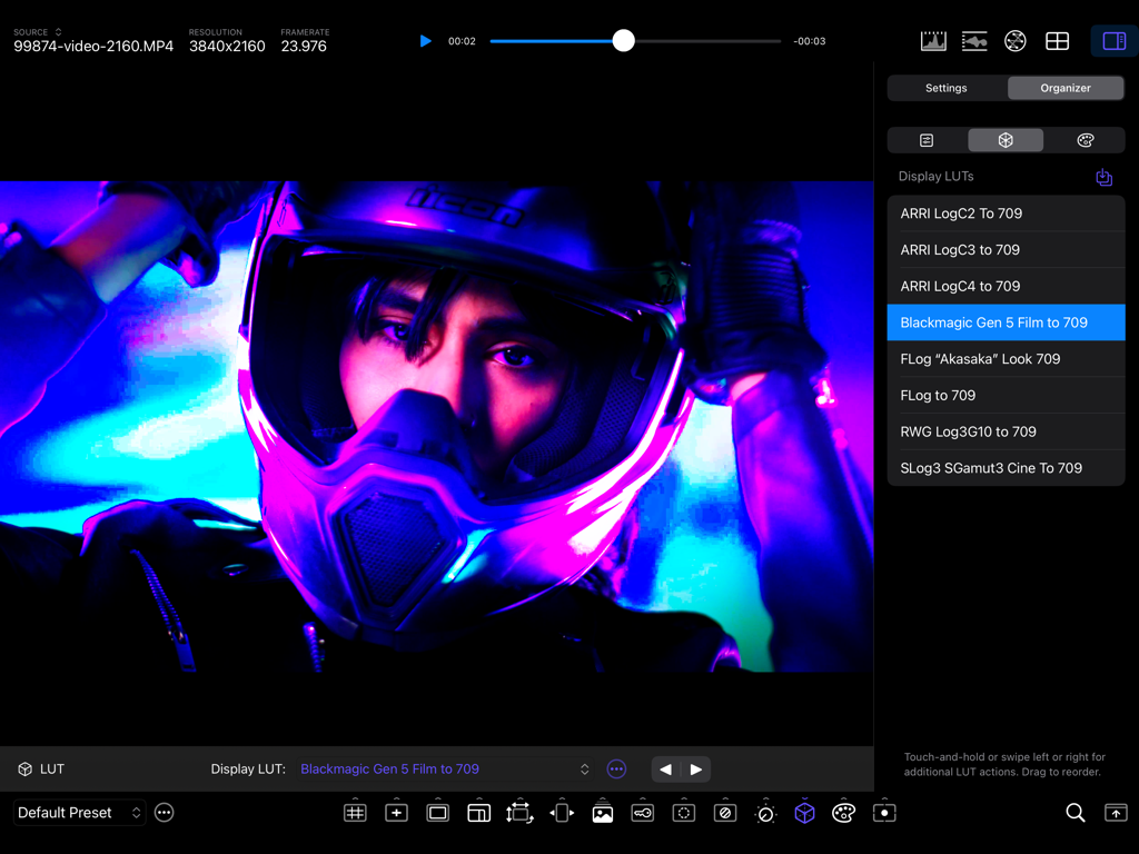 CineMon - Professional video monitoring interface in CineMon app showing LUT selection for a video feed of a motorcyclist in neon light