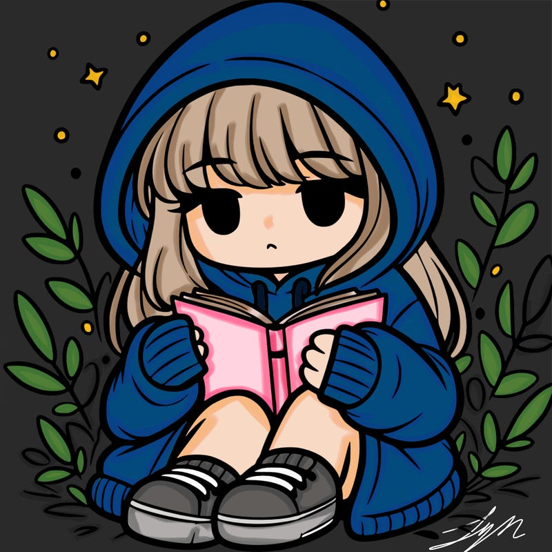 girl in oversized hoodie reading a book